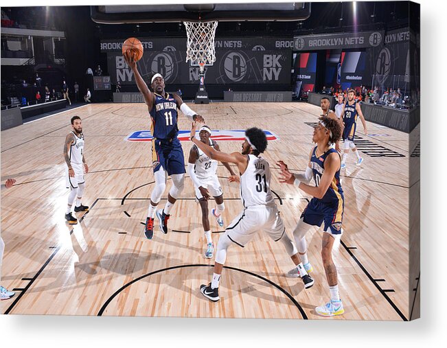 Nba Pro Basketball Acrylic Print featuring the photograph Jrue Holiday by Jesse D. Garrabrant