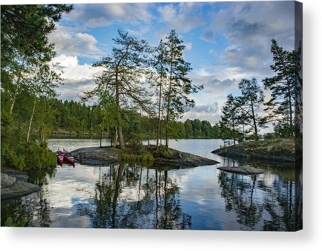 Water's Edge Acrylic Print featuring the photograph Lake with trees and rocks in the Dalsland Lake District in Sweden. by Sjo