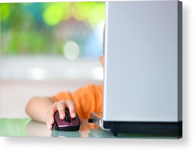 Working Acrylic Print featuring the photograph Little boy using laptop by Fotostorm