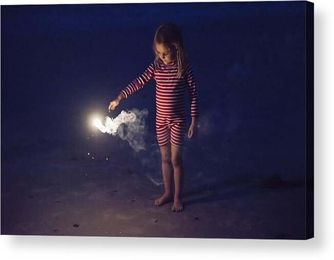4-5 Years Acrylic Print featuring the photograph Little girl playing with bengal fire on the beach at dusk. by Martinedoucet