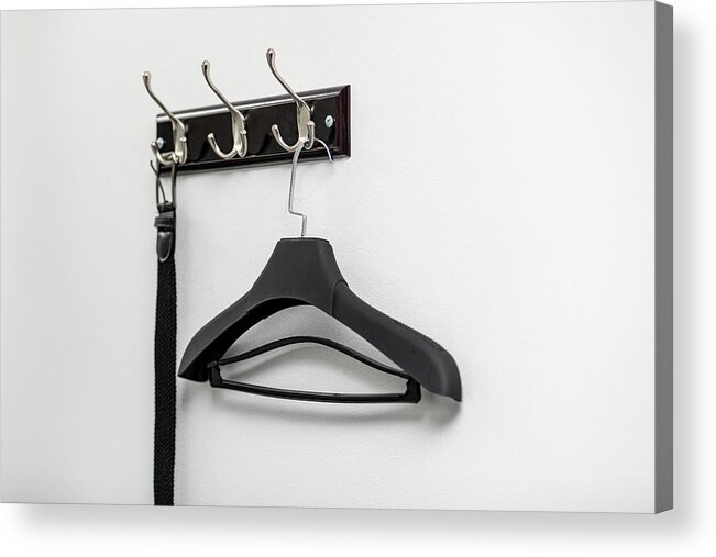 Lifestyles Acrylic Print featuring the photograph Male leather belt on hanger on hooks. by Shcherbak Volodymyr