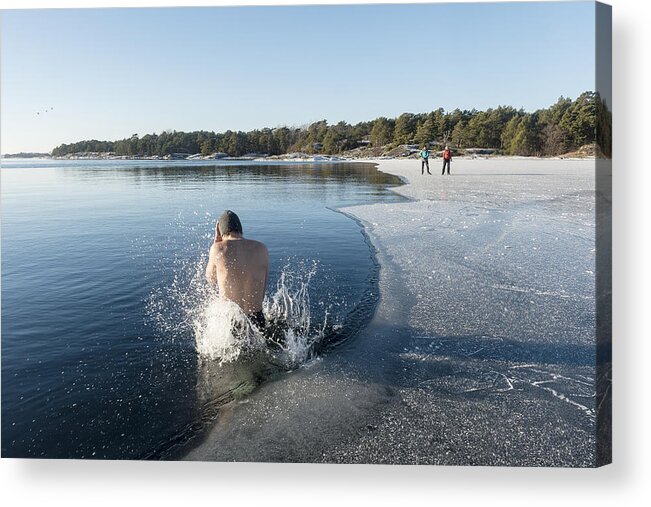 Archipelago Acrylic Print featuring the photograph Man jumping into freezing cold water by Johner Images