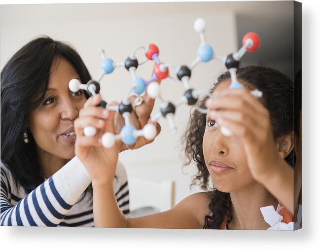 Tranquility Acrylic Print featuring the photograph Mother and daughter examining molecular model by JGI/Jamie Grill