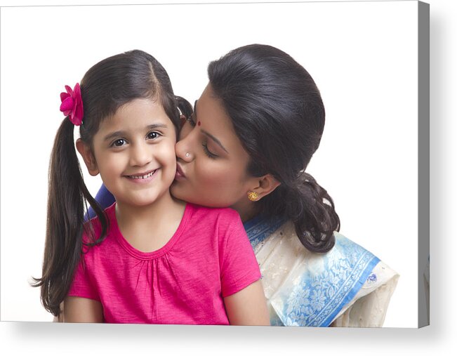 Child Acrylic Print featuring the photograph Mother kissing her daughter on the cheek by Sudipta Halder