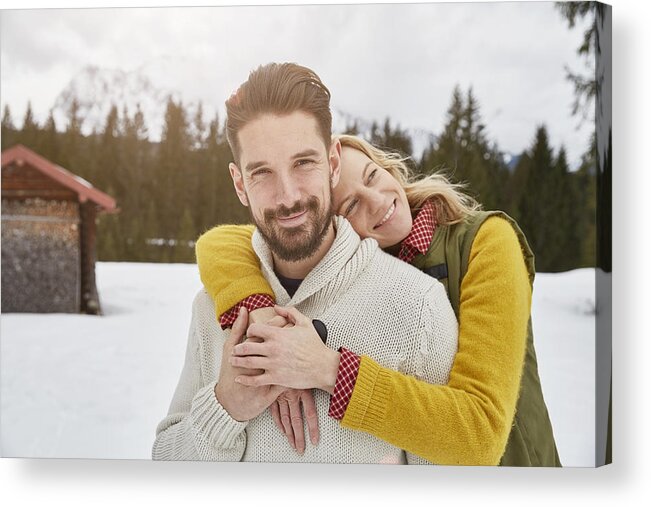 Young Men Acrylic Print featuring the photograph Portrait of romantic couple in snow, Elmau, Bavaria, Germany by Stephen Lux