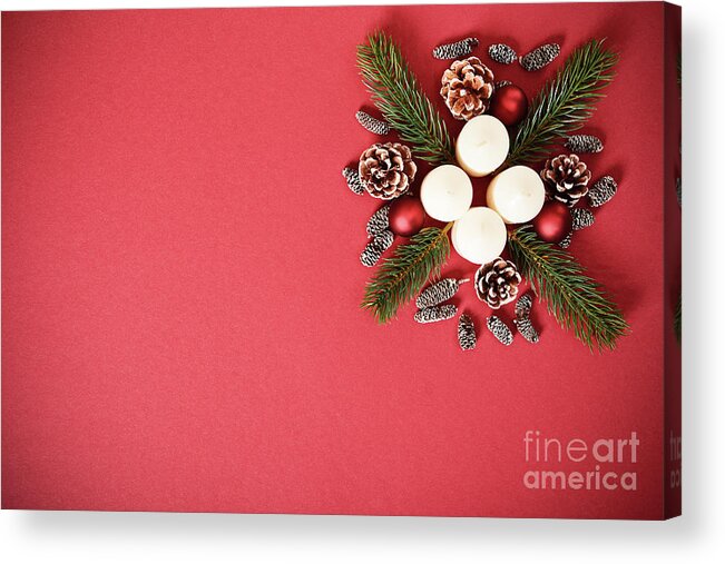 Seasonal Acrylic Print featuring the photograph Seasonal greeting card concept with candles, pine cones and everg by Mendelex Photography