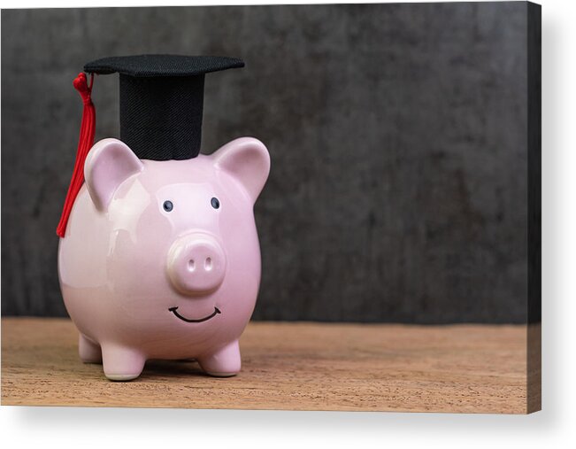 Black Color Acrylic Print featuring the photograph Smiling pink piggy bank wearing graduated hat on wooden table with dark black background and copy space, education fund, Scholarships, university cost and expense or saving for student loan concept by Nuthawut Somsuk