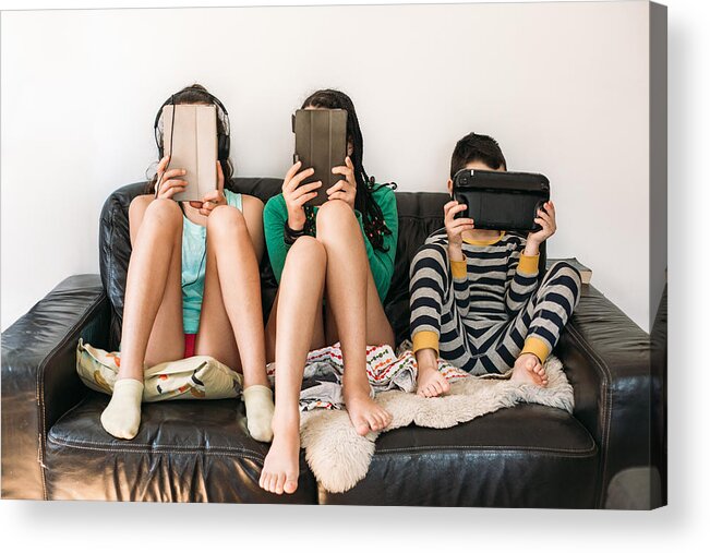 Internet Acrylic Print featuring the photograph Three Kids With Electronic Devices On A Sofa by Os Tartarouchos
