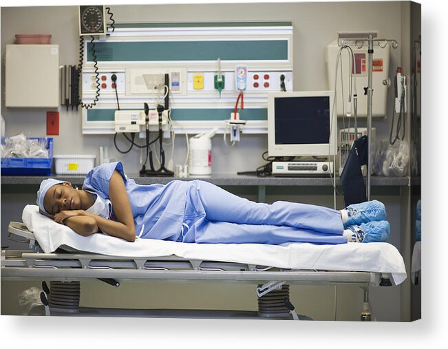 Expertise Acrylic Print featuring the photograph Tired black surgeon laying on hospital gurney by ER Productions Limited