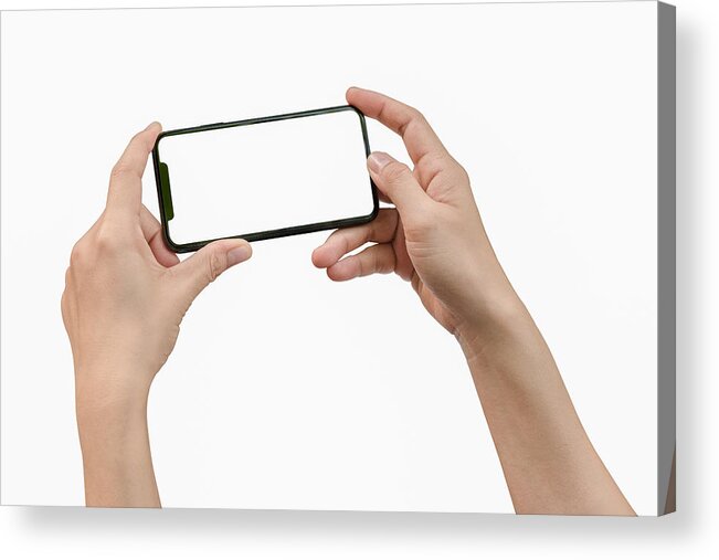 Empty Acrylic Print featuring the photograph Two hands holding big screen smart phone by Issarawat Tattong
