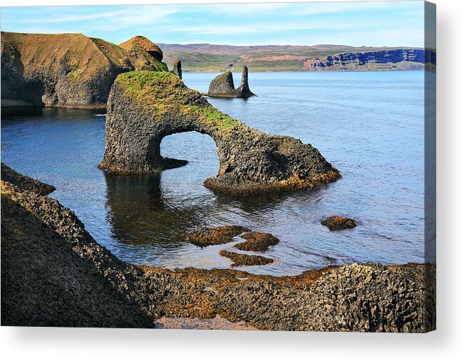 Water's Edge Acrylic Print featuring the photograph Volcanic arch on a rough coast of the Atlantic ocean in Iceland by Rainer Grosskopf