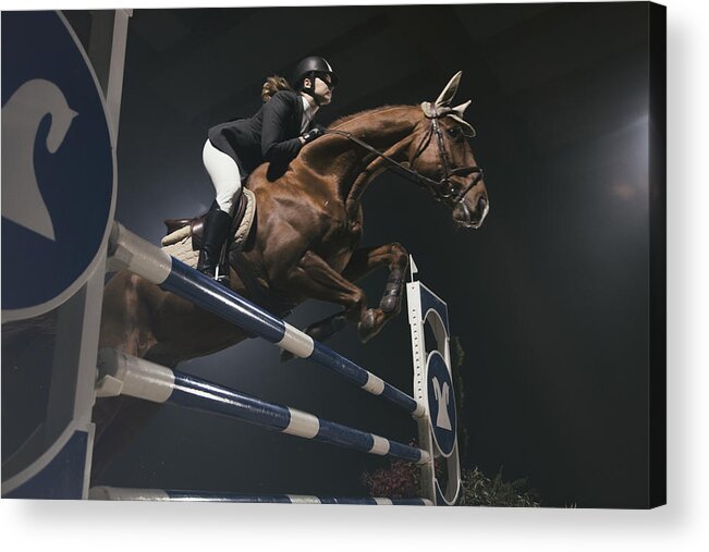 Horse Acrylic Print featuring the photograph Woman jumping with horse over the hurdle by Tomazl