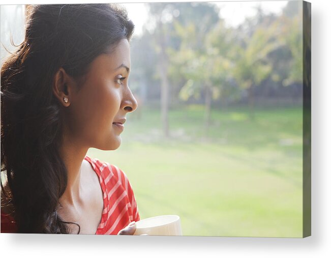 Asian And Indian Ethnicities Acrylic Print featuring the photograph Woman looking out of window by Ravi Ranjan