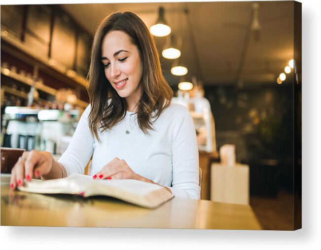 People Acrylic Print featuring the photograph Woman Reading Book in Coffee Shop by RyanJLane