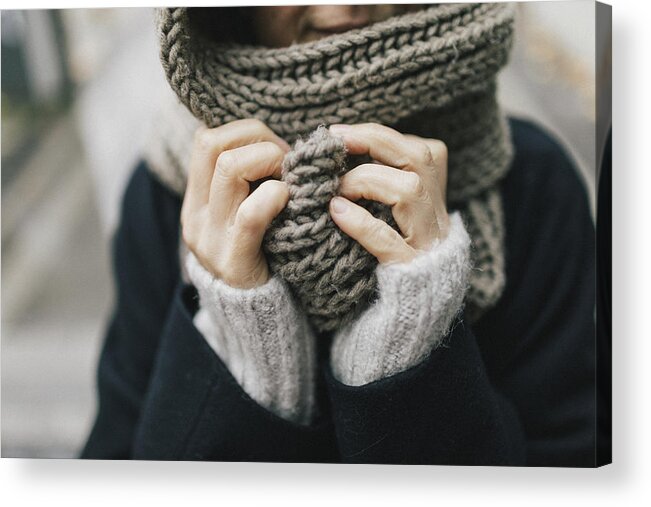 Cool Attitude Acrylic Print featuring the photograph Woman's hand holding knitted scarf, close-up by Westend61