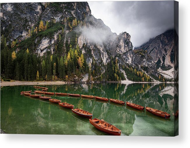 Lago Di Braies Acrylic Print featuring the photograph Wooden boats on the peaceful lake. Lago di braies, Italy by Michalakis Ppalis