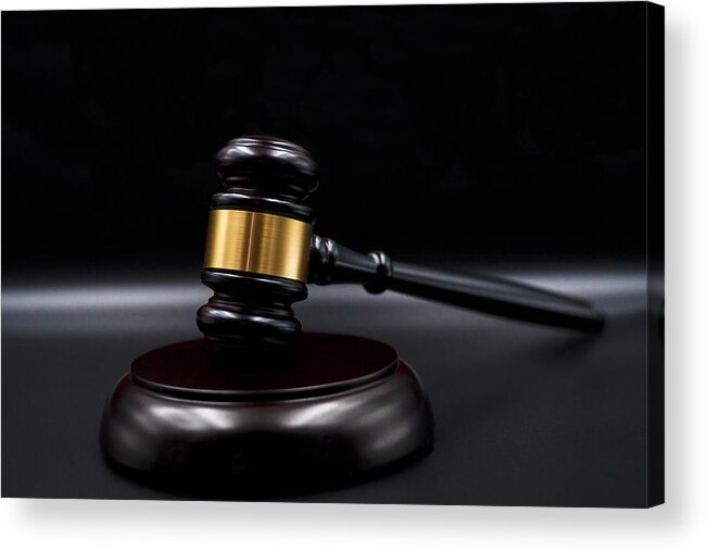 Guilt Acrylic Print featuring the photograph Wooden court gavel on black background. Symbol of justice, judge and trial. Auction. Law and Justice, Legality concept, Judge. by Jantanee Phoolmas