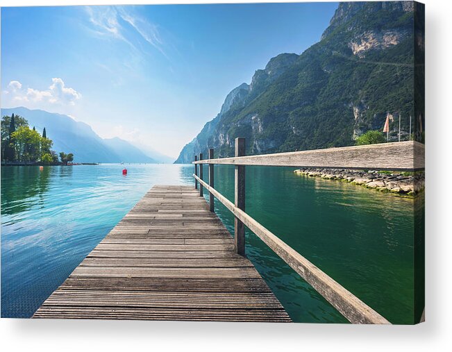 Garda Acrylic Print featuring the photograph Wooden pier on the lake. Riva del Garda. by Stefano Orazzini