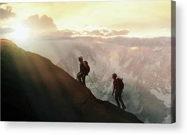 Heterosexual Couple Acrylic Print featuring the photograph Climbers On A Mountain Ridge by Buena Vista Images