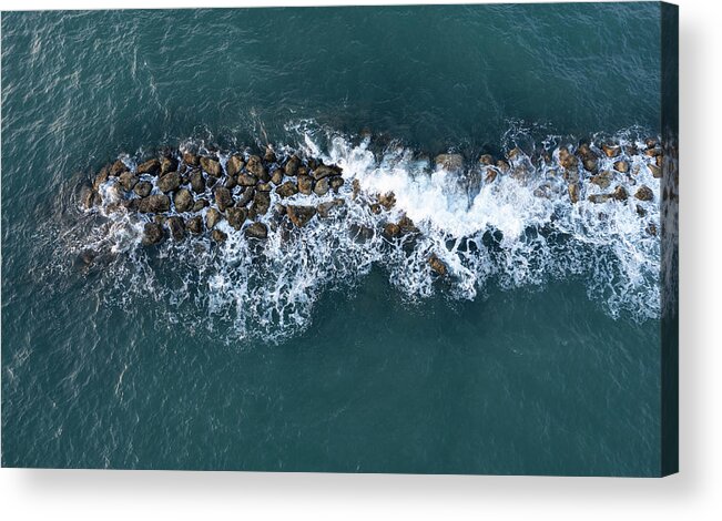 Ocean Acrylic Print featuring the photograph Aerial view from a flying drone of blue sea water and break water. Sea wall coastline by Michalakis Ppalis