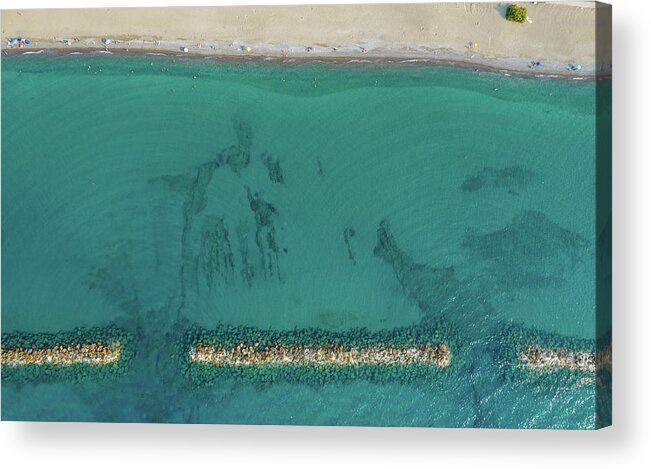 Beachfront Acrylic Print featuring the photograph Aerial view from flying drone of people relaxing on the beach. Paphos Cyprus by Michalakis Ppalis