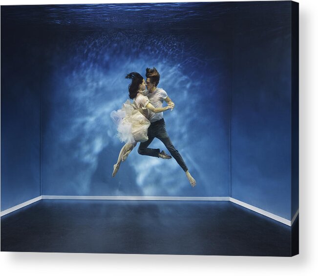 Tranquility Acrylic Print featuring the photograph A couple dancing under water by Henrik Sorensen