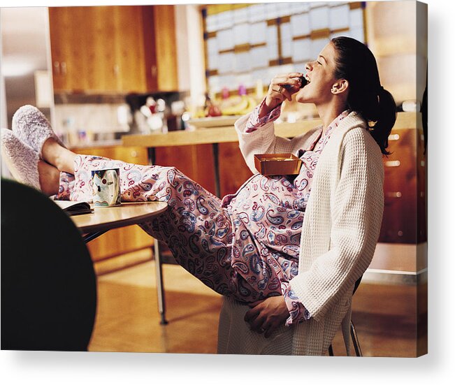Caucasian Ethnicity Acrylic Print featuring the photograph Pregnant Woman Eating Chocolate by Cohen/Ostrow