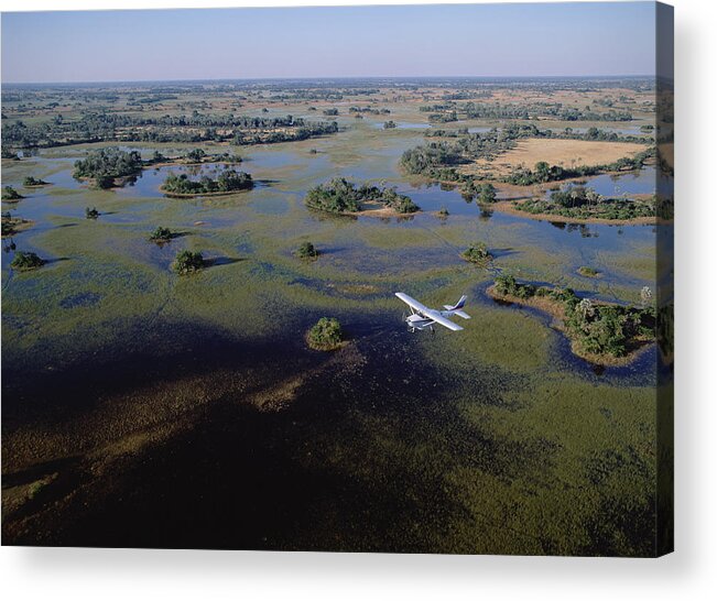 Feb0514 Acrylic Print featuring the photograph Safari Airplane Flying Over Okavango by Konrad Wothe