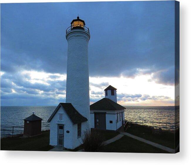 The Light At Tibbetts Point Lighthouse Shines With The December Clouds Acrylic Print featuring the photograph December light, Tibbetts Point by Dennis McCarthy