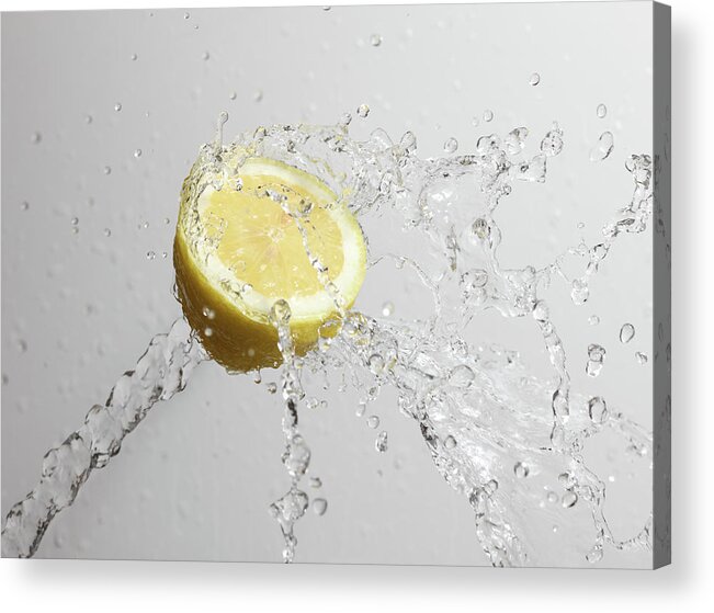 Motion Acrylic Print featuring the photograph Cut Lemon Splashed With Water by Vincenzo Lombardo