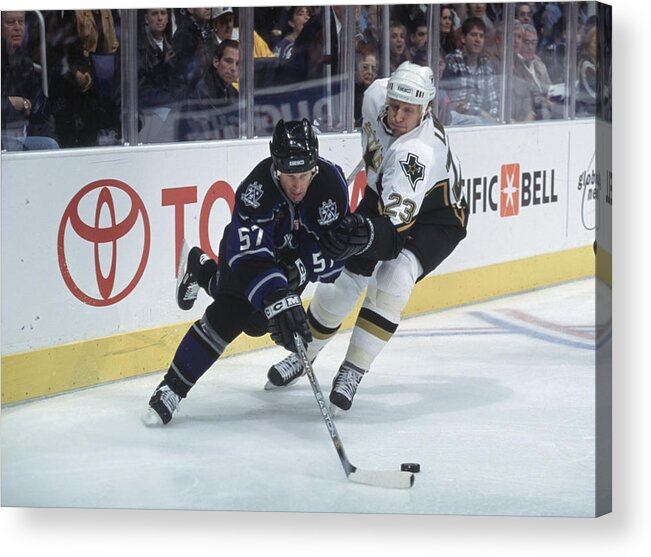 National Hockey League Acrylic Print featuring the photograph Steve Heinze skateS towards the puck by Jeff Gross
