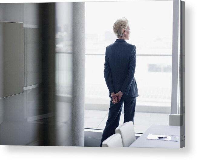 Corporate Business Acrylic Print featuring the photograph Businesswoman standing at window in office by Sam Edwards