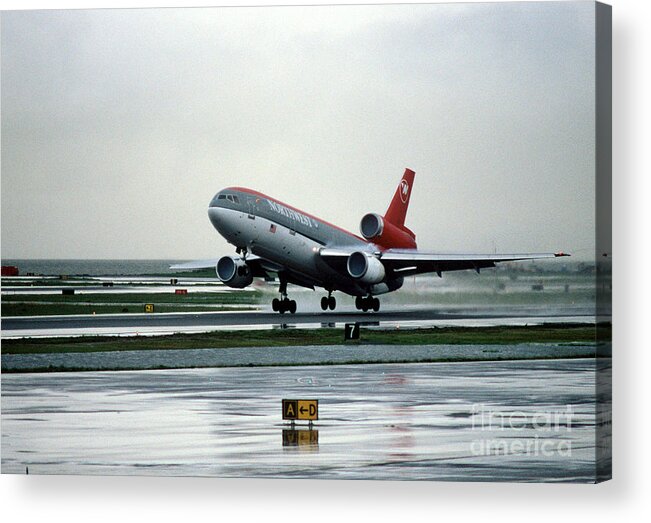N154us Acrylic Print featuring the photograph Douglas DC-10-40 Taking Off in the Rain by Wernher Krutein