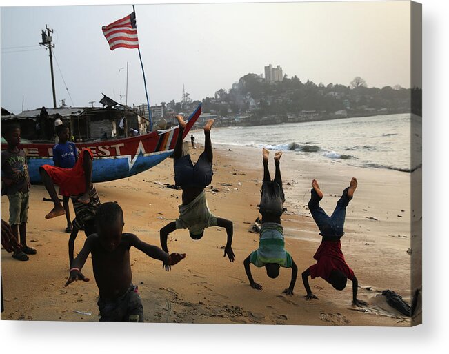 Child Acrylic Print featuring the photograph Ebola Epidemic Over, Liberias West by John Moore