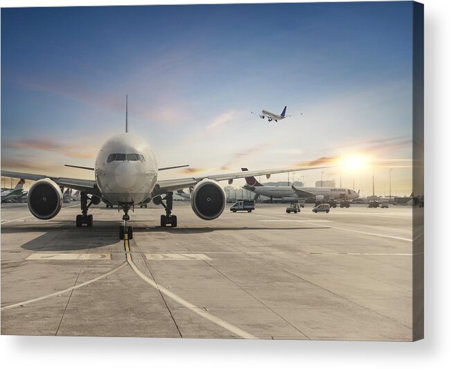 Taking Off Acrylic Print featuring the photograph Front view of landed airplane in Istanbul International Airport by Guvendemir