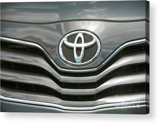 Grey Toyota Grill Headlight Cars Acrylic Print featuring the photograph Grey Toyota Grill and Emblem Smile by David Zanzinger