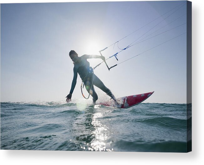 Horizon Acrylic Print featuring the photograph Kitesurfer Illuminated By The Sunlight by Ben Welsh