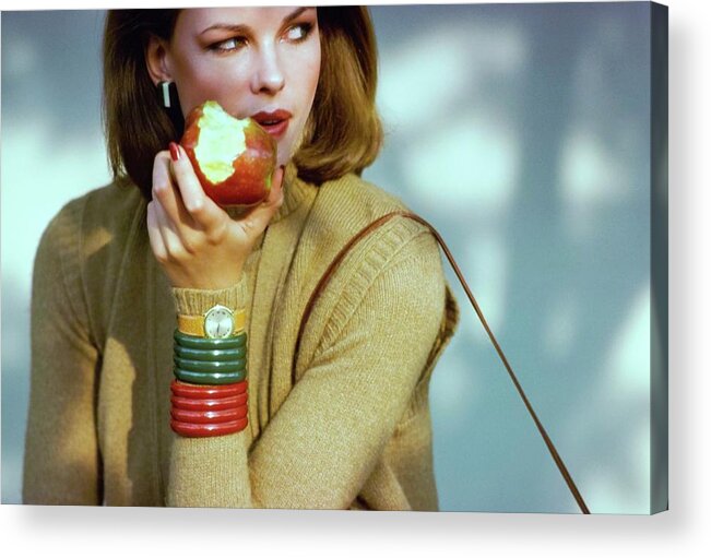 Fashion Acrylic Print featuring the photograph Lisa Taylor Eating An Apple by Arthur Elgort