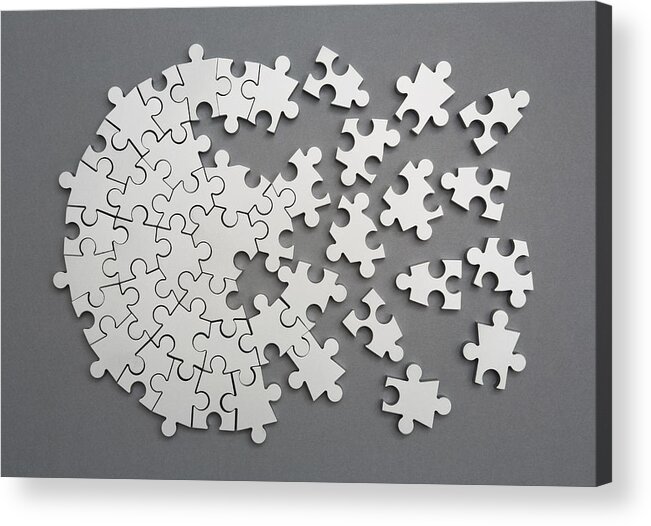 Teamwork Acrylic Print featuring the photograph Radiating silver metal puzzle, half assembled by Dimitri Otis