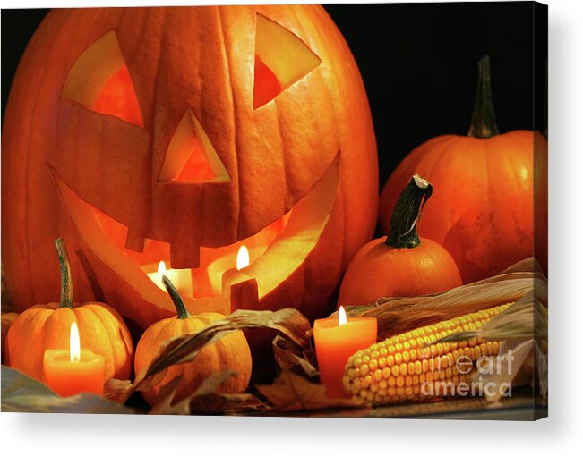 Agriculture Acrylic Print featuring the photograph Carved pumpkin with candles by Sandra Cunningham