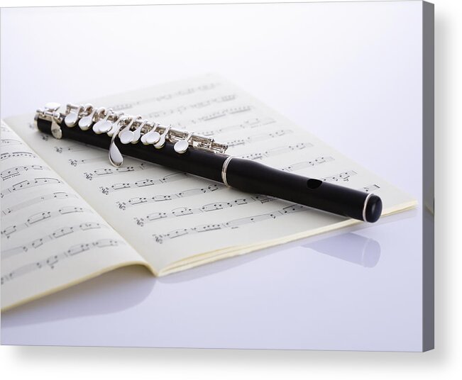 Sheet Music Acrylic Print featuring the photograph Piccolo On A Score #1 by Imagenavi