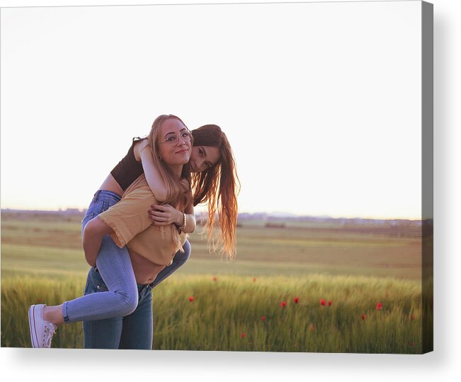 Pregnant Acrylic Print featuring the photograph Two Women Holding Hands At Sunset In The Field #6 by Cavan Images