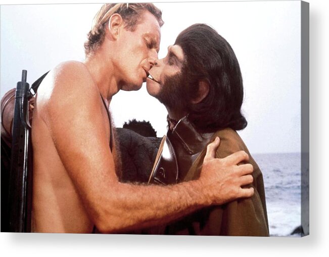 Charlton Heston Acrylic Print featuring the photograph CHARLTON HESTON and KIM HUNTER in PLANET OF THE APES -1968-. by Album