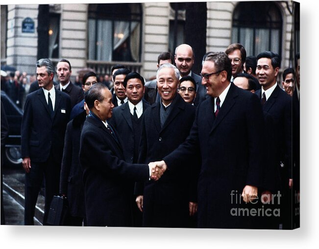 Vietnam War Acrylic Print featuring the photograph Henry Kissinger And Le Duc Tho Shaking by Bettmann