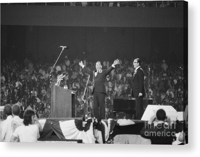 Crowd Of People Acrylic Print featuring the photograph Rev. Sun Myung Moon Gestures To Crowd by Bettmann