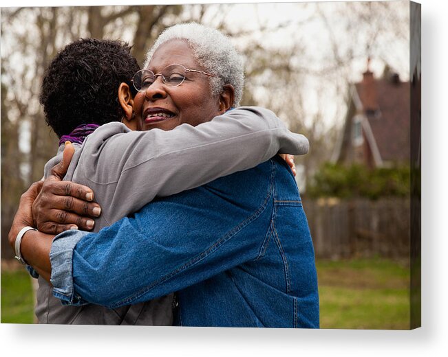 Adult Offspring Acrylic Print featuring the photograph African American senior hugging her daughter by Ron Levine