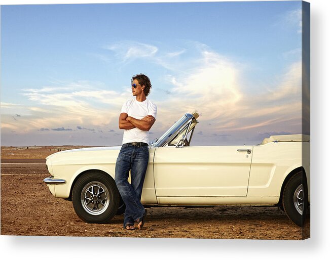 Tranquility Acrylic Print featuring the photograph Caucasian man relaxing on convertible on remote road by Colin Anderson Productions pty ltd