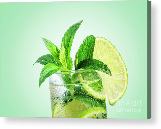 Mojito Acrylic Print featuring the photograph Closeup mojito cocktail with ice isolated over pastel background by Jelena Jovanovic