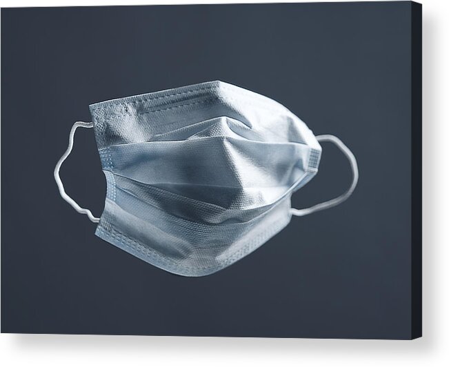 Cold And Flu Acrylic Print featuring the photograph Medical Used Face Mask, Protects Against Virus. Concept Of Air Pollution, Pneumonia Outbreaks, Coronavirus Epidemics, And The Risk Of Biological Contamination. by Aleksandr Zubkov