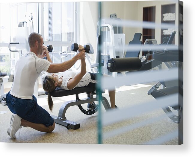 Three Quarter Length Acrylic Print featuring the photograph Personal Trainer Helping Woman Work Out by Andersen Ross